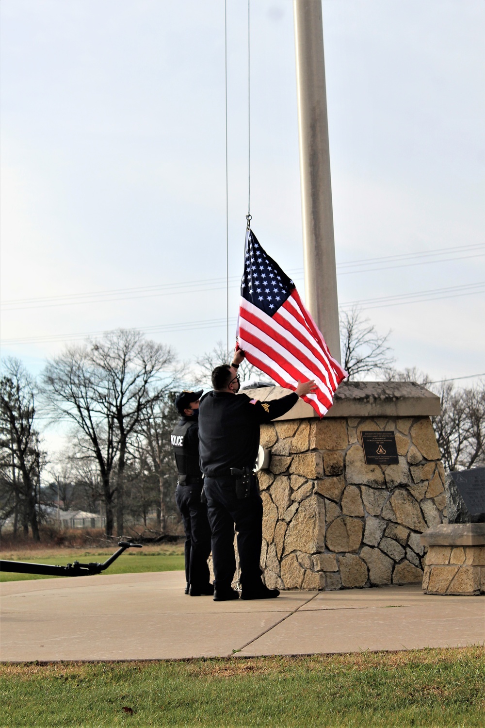 Fort McCoy Police Department officers complete flag raising event