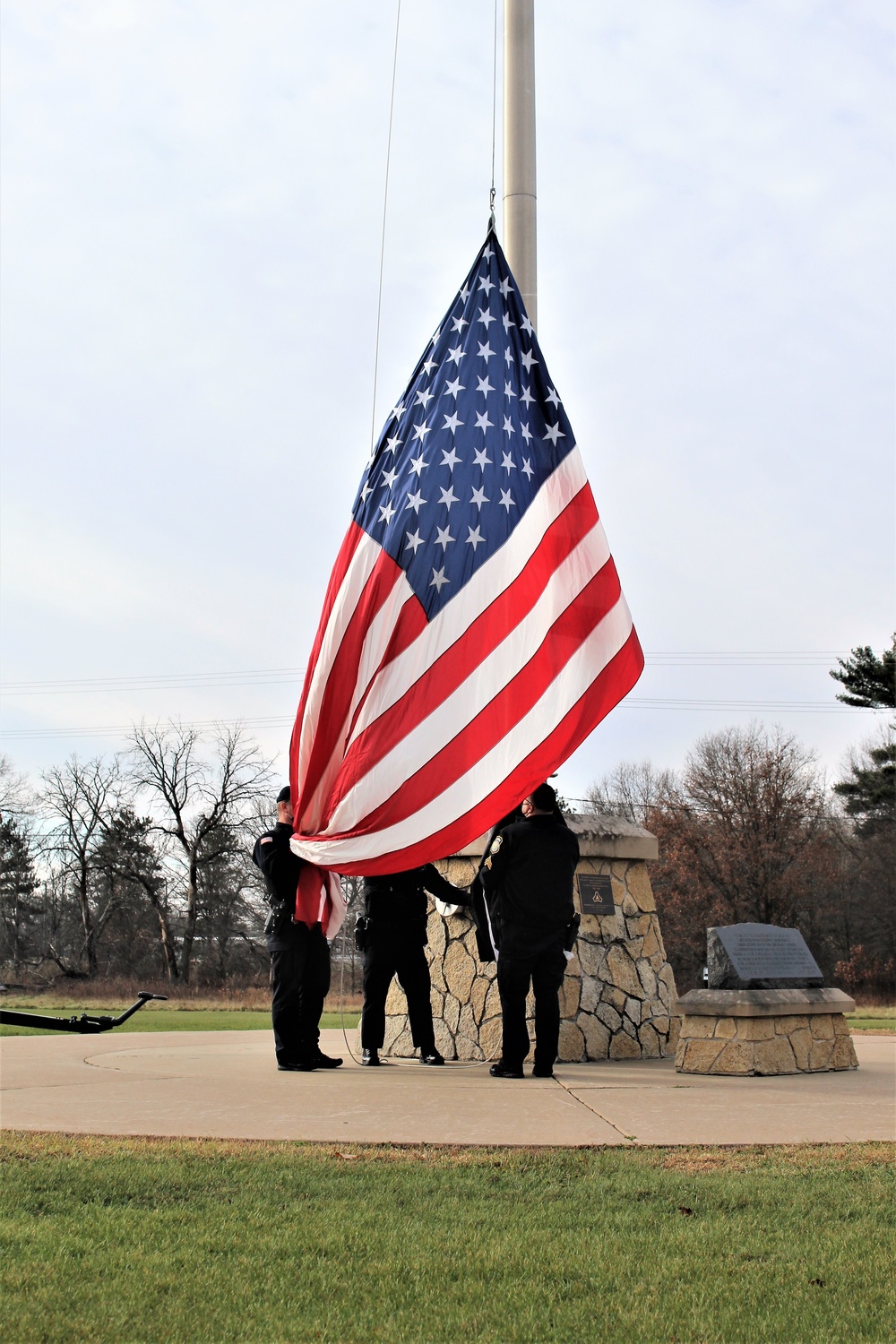 Fort McCoy Police Department officers complete flag raising event