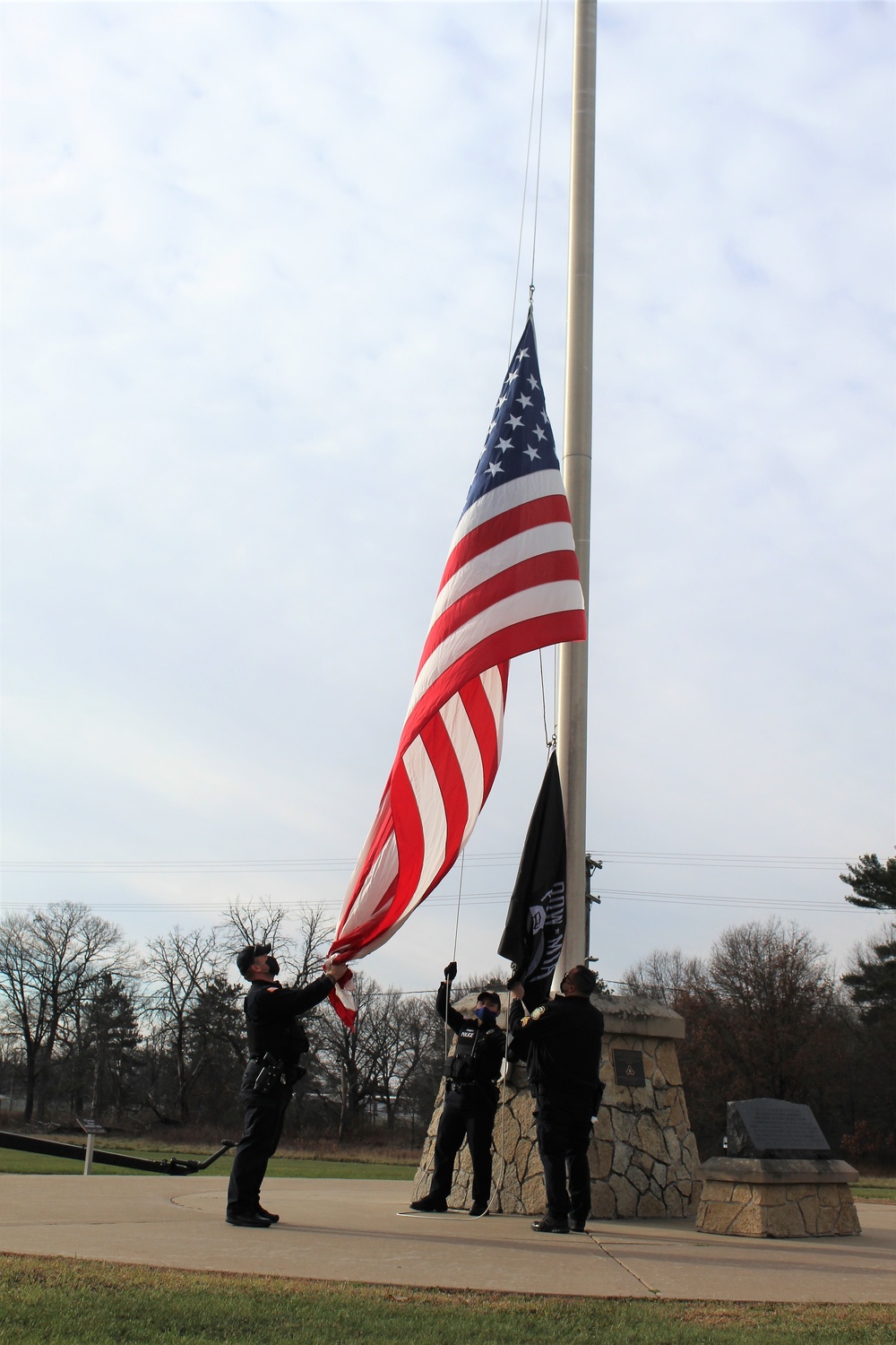 Fort McCoy Police Department officers complete flag raising event