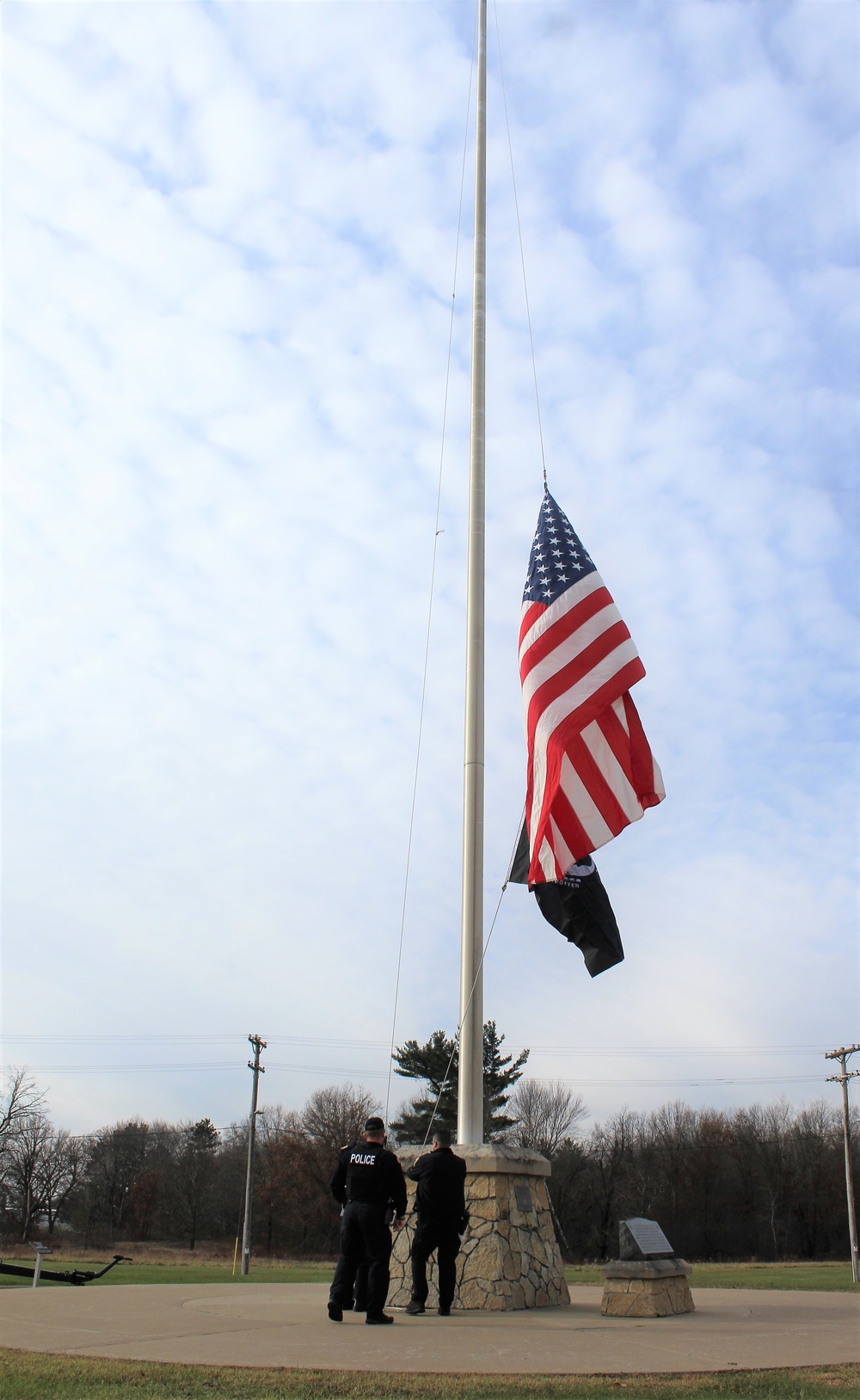 Fort McCoy Police Department officers complete flag raising event