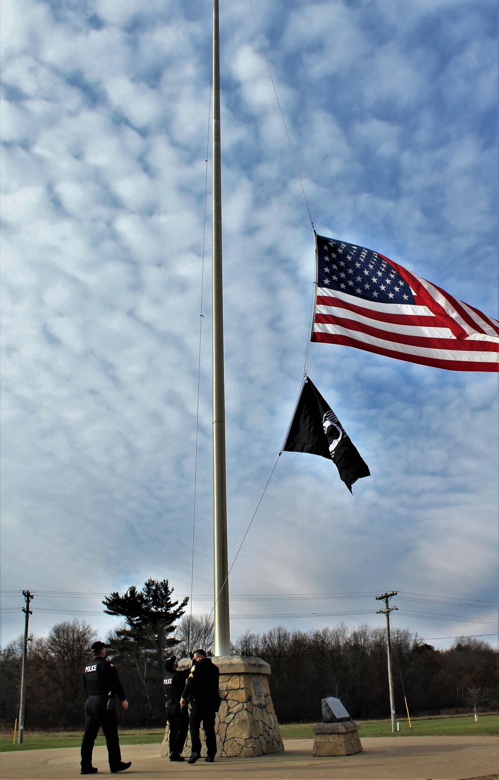 Fort McCoy Police Department officers complete flag raising event
