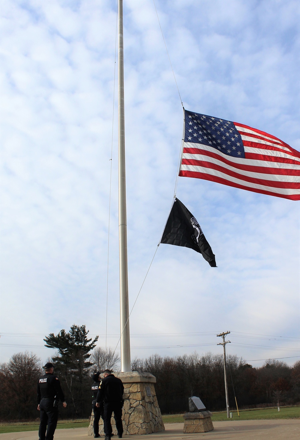 Fort McCoy Police Department officers complete flag raising event