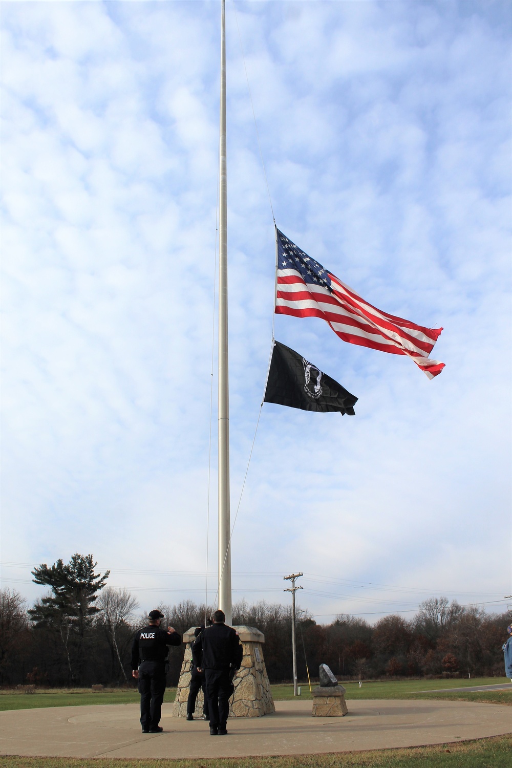 Fort McCoy Police Department officers complete flag raising event