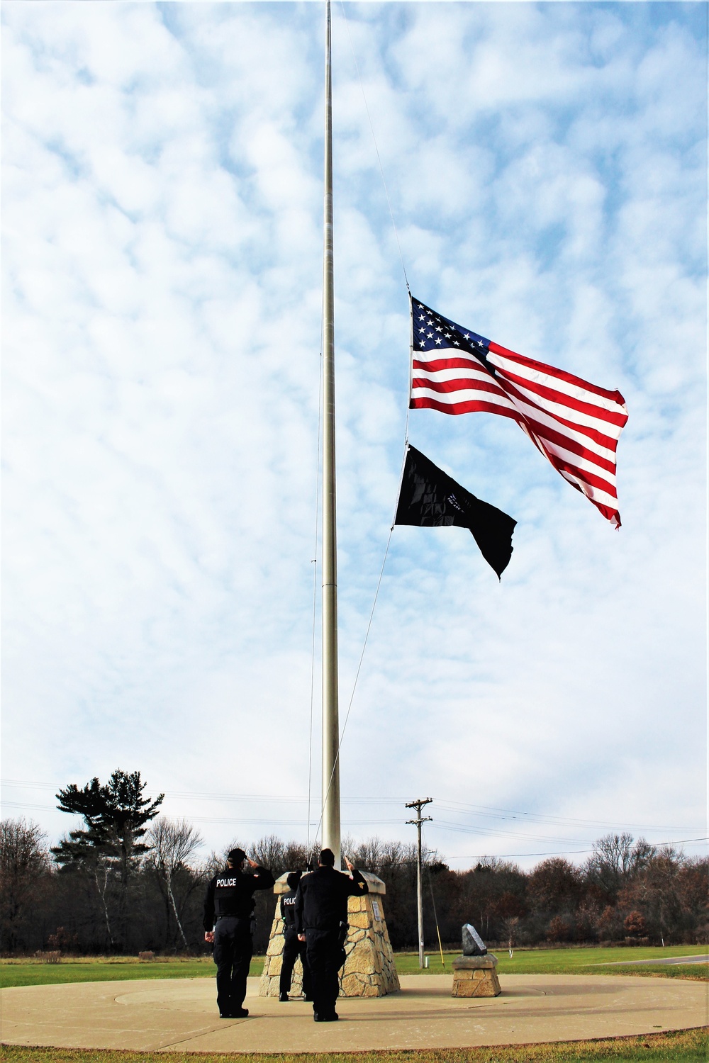 Fort McCoy Police Department officers complete flag raising event