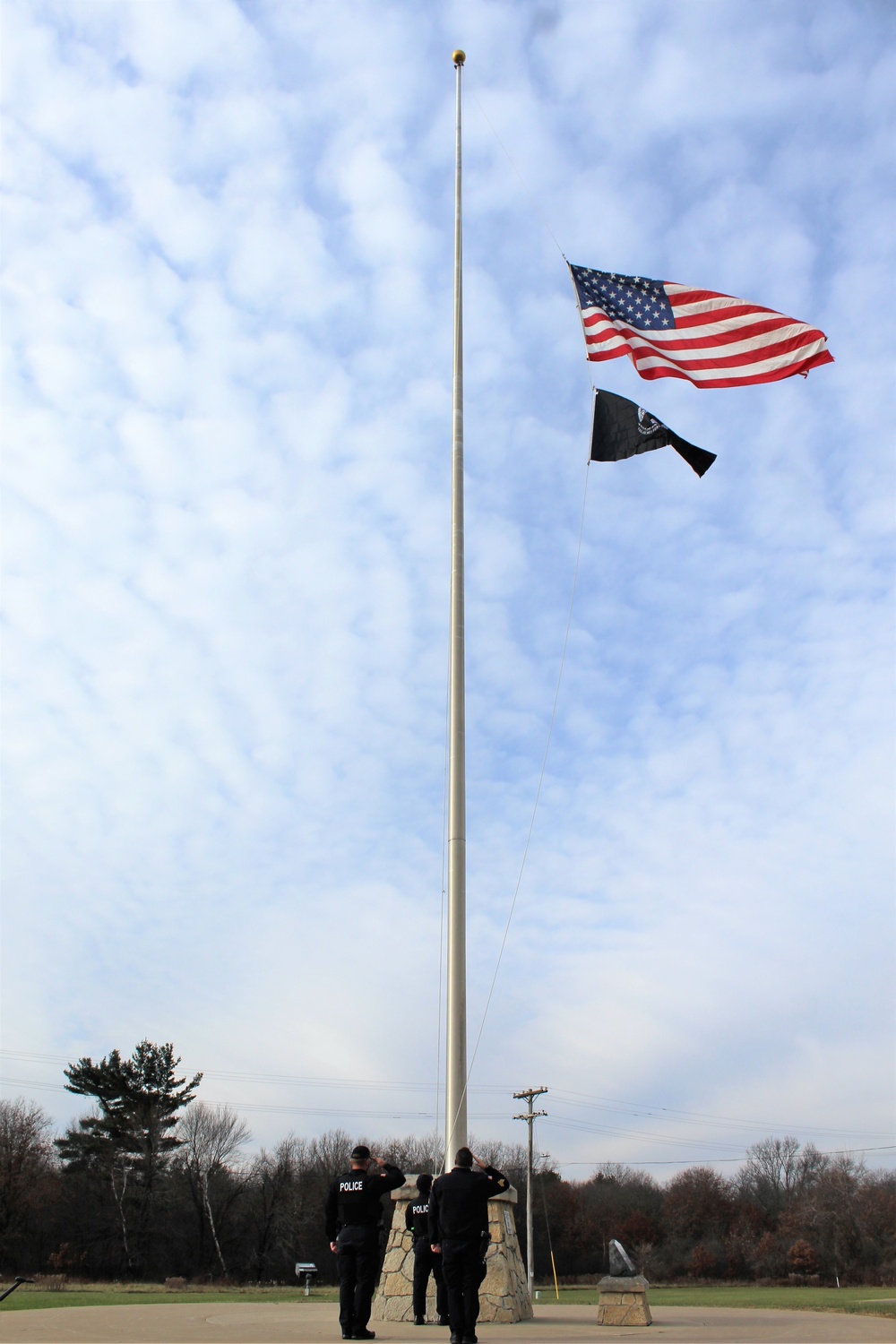 Fort McCoy Police Department officers complete flag raising event