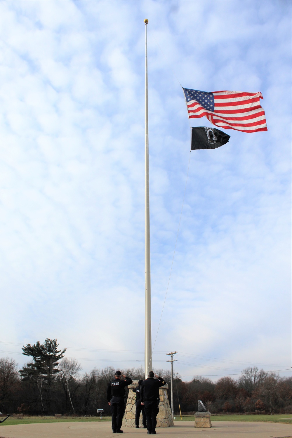 Fort McCoy Police Department officers complete flag raising event