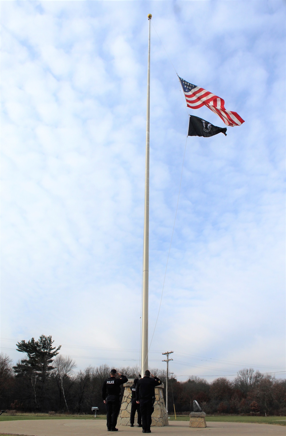 Fort McCoy Police Department officers complete flag raising event