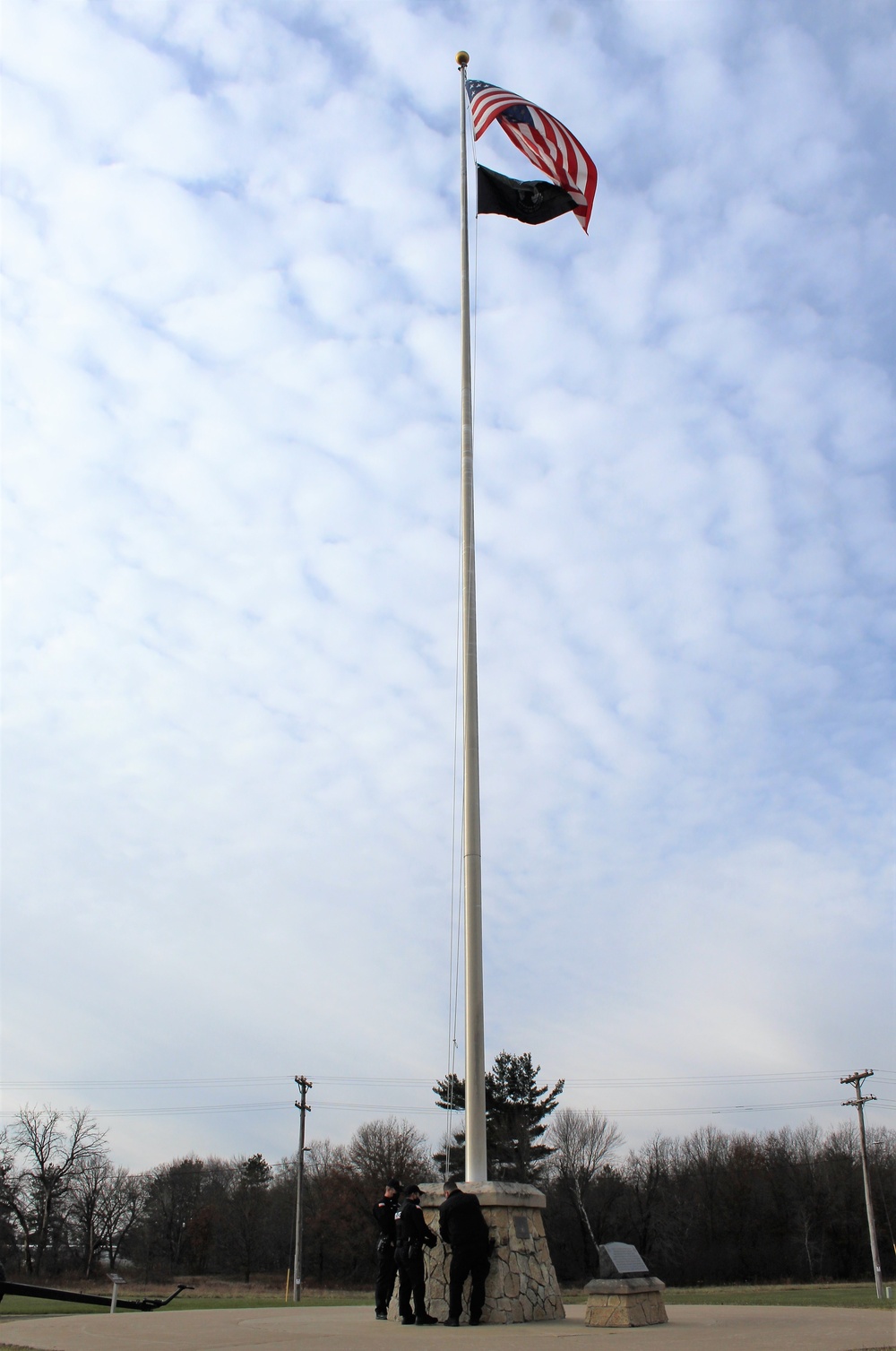 Fort McCoy Police Department officers complete flag raising event