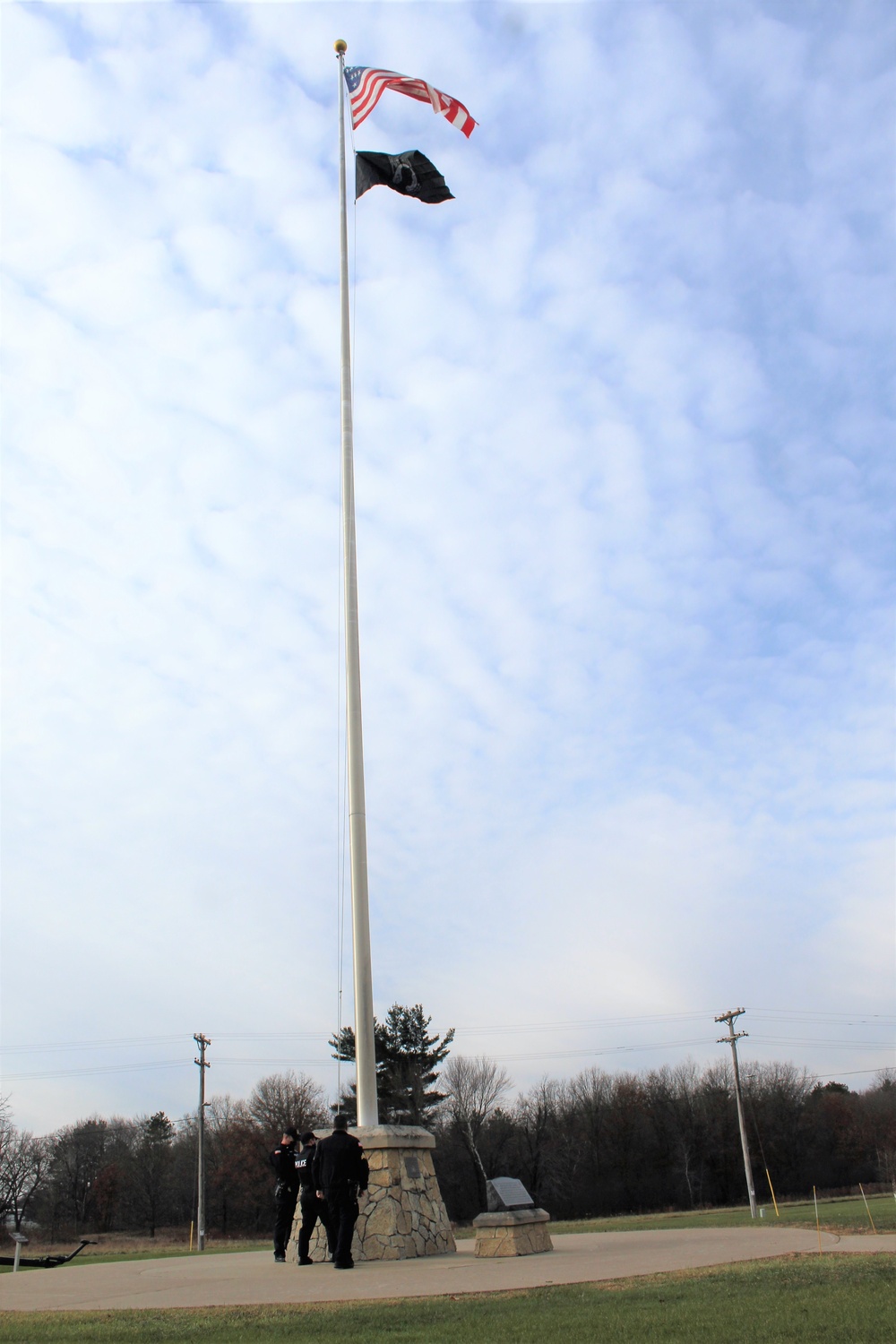 Fort McCoy Police Department officers complete flag raising event