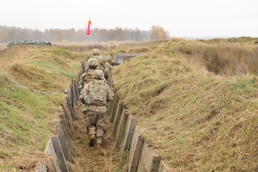 Troop Takes to the Trenches