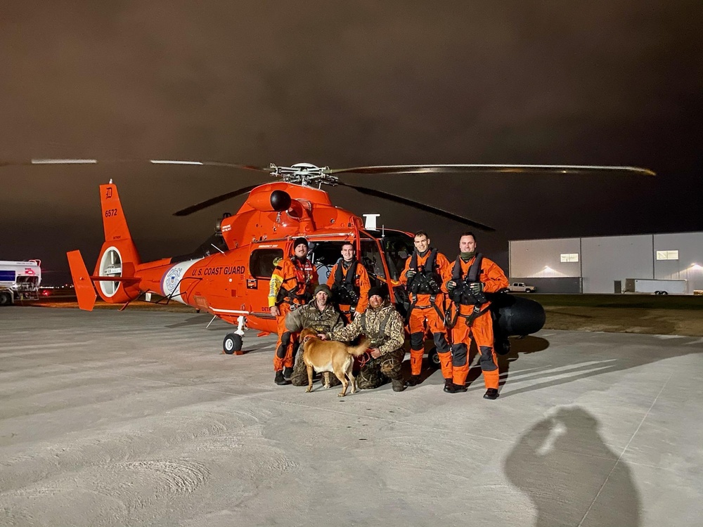 Coast Guard Air Station Detroit crew rescues 2 hunters and dog
