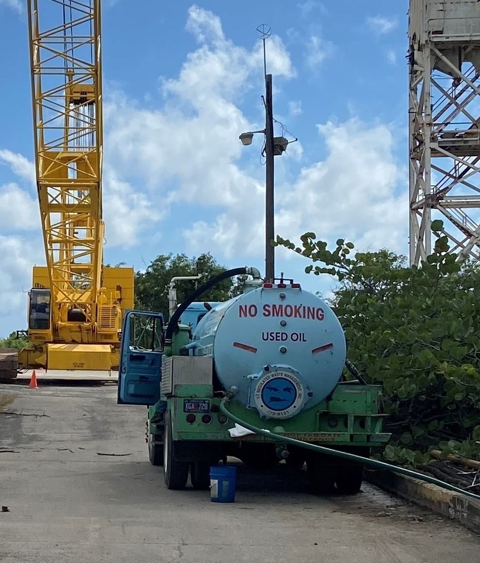Coast Guard monitors clean-up operations for oil discharge from partially sunken tugboat in St. Croix, U.S. Virgin Islands