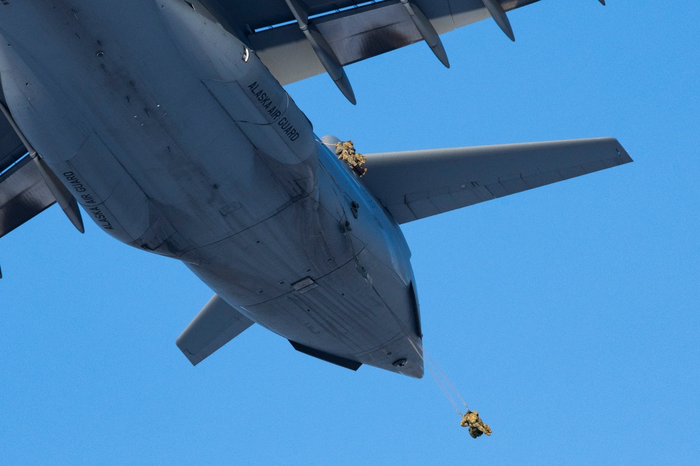 Air Force special warfare Airmen and Army paratroopers conduct airborne operations at JBER
