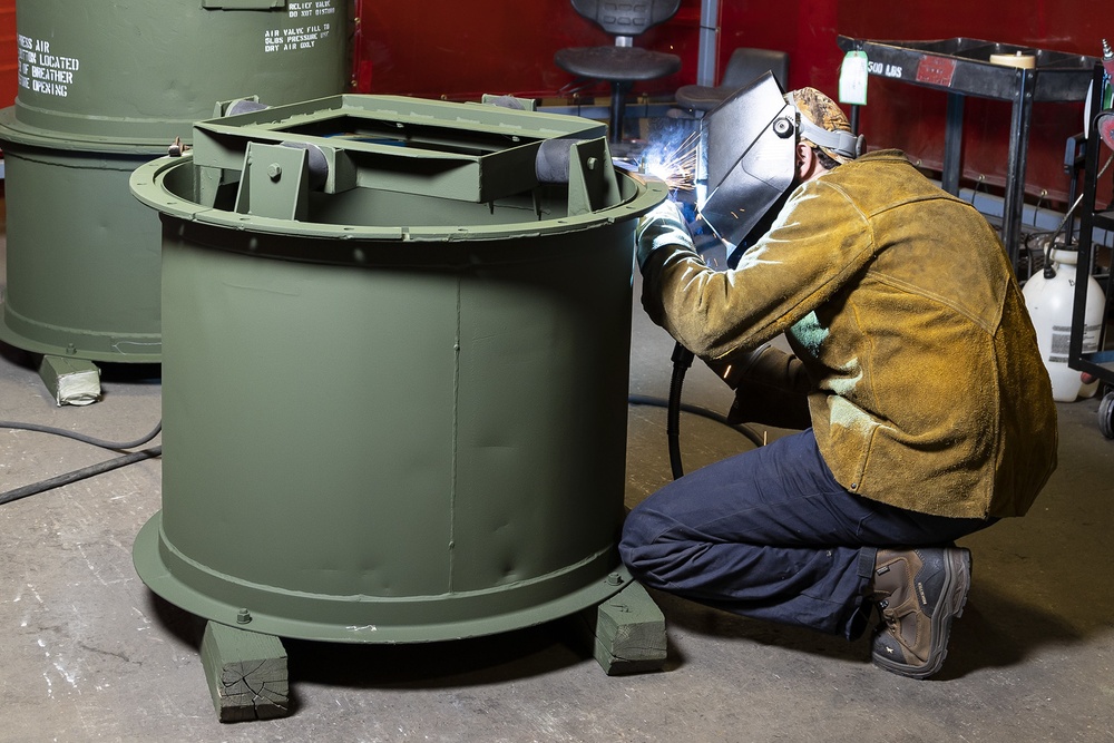 Shipping containers used to deliver components to the warfighter