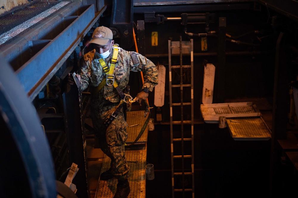 Sailor performs maintenance