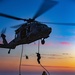 15th MEU Marines fast-rope from a helicopter onto USS Makin Island
