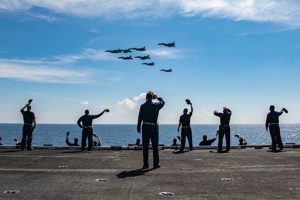 Nimitz Sailors Wave at Formation of U.S and Indian Fighter Aircraft