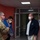 Guard medical team visits Czech Military University Hospital Prague A U.S. military soldier in MultiCam/OCP camouflage uniform is meeting with what appear to be medical staff in a hospital or clinical corridor. All four individuals are wearing face masks, suggesting this interaction took place during COVID-19 precautionary protocols. The setting appears to be a European medical facility based on the architecture and signage.