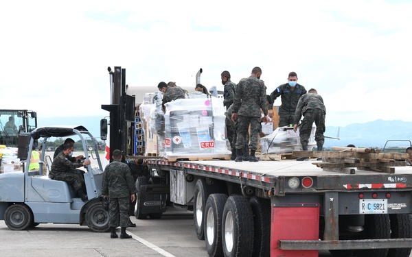 Members of Honduran Air Force Load Pallets of Humanitarian Assistance