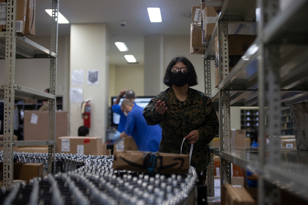 US Marines sort mail during their busiest time of year