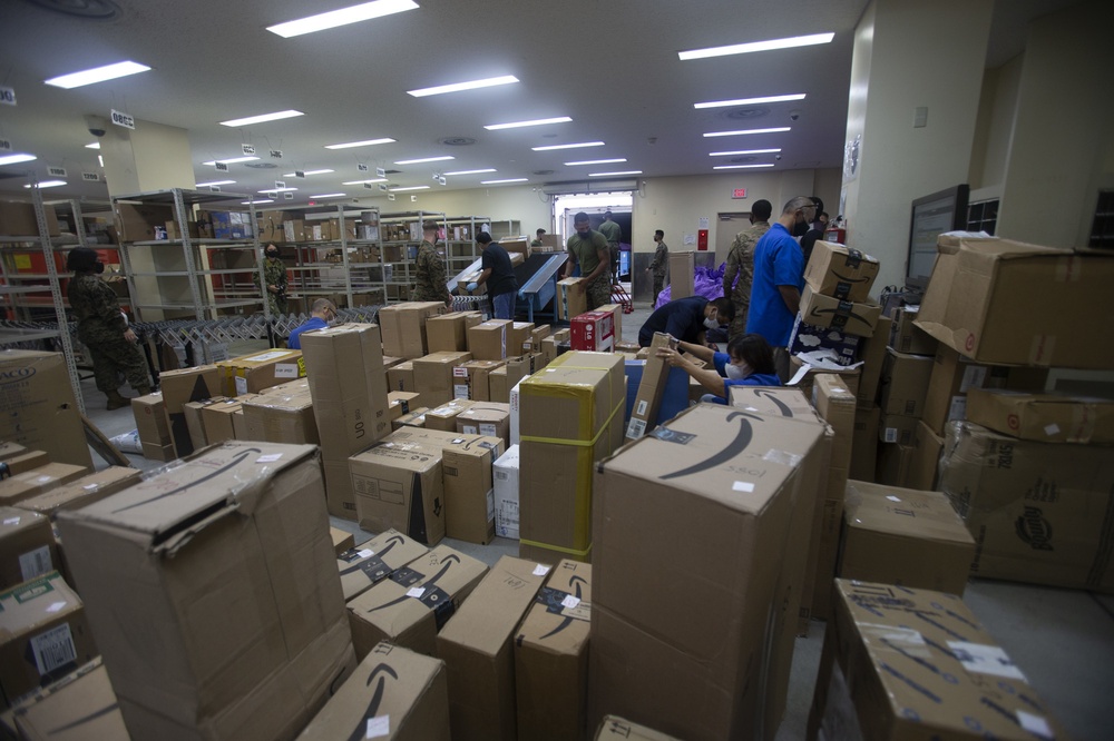 US Marines sort mail during their busiest time of year