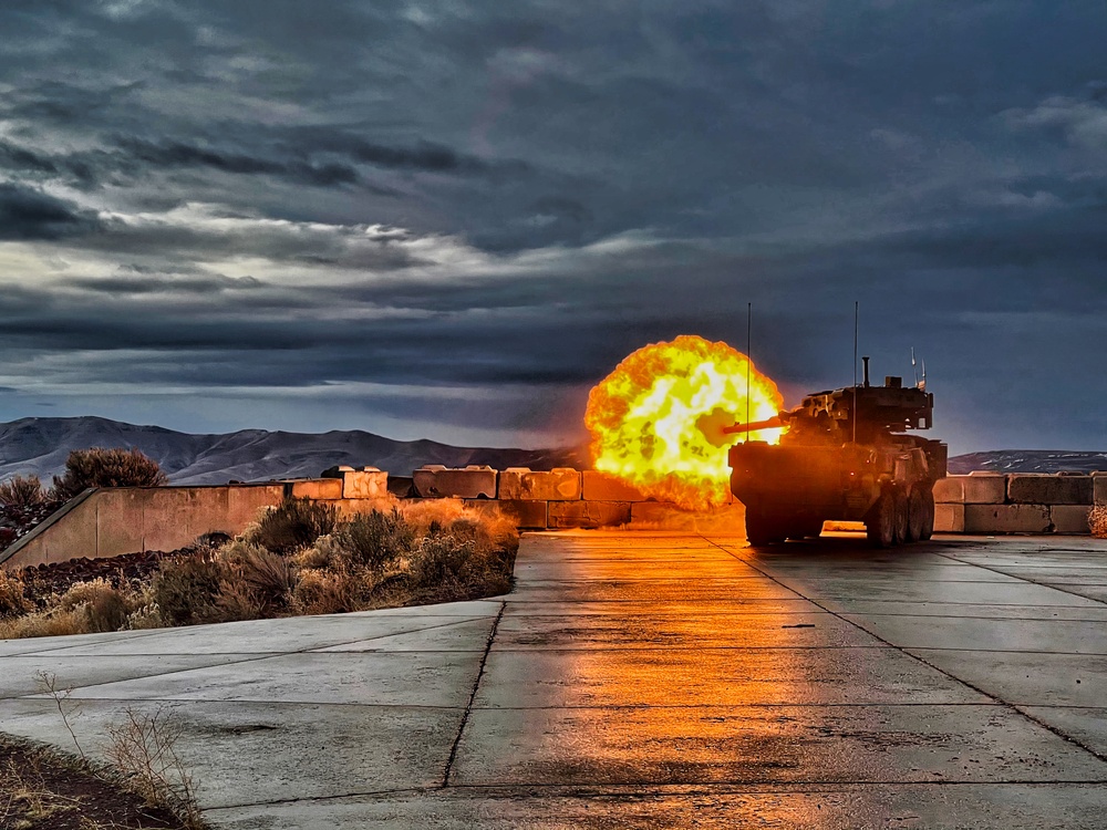 Stryker M1128 Mobile Gun System fires canister round at Yakima Training Center