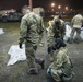 A Green Beret is notionally decontaminated by a soldier with 110th CBRN Battalion