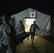 Soldiers with 62nd Medical Brigade provide simulated care to a casualty