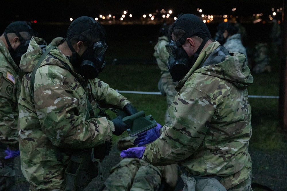 Soldiers from 8th Chemical Brigade notionally test for contaminants during a training event