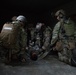 Soldiers help Green Berets give first aid during training exercise