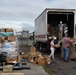 Honduran Volunteers Load Donated Medical Supplies and Equipment