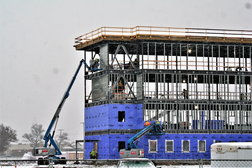 Barracks construction during a November snow at Fort McCoy