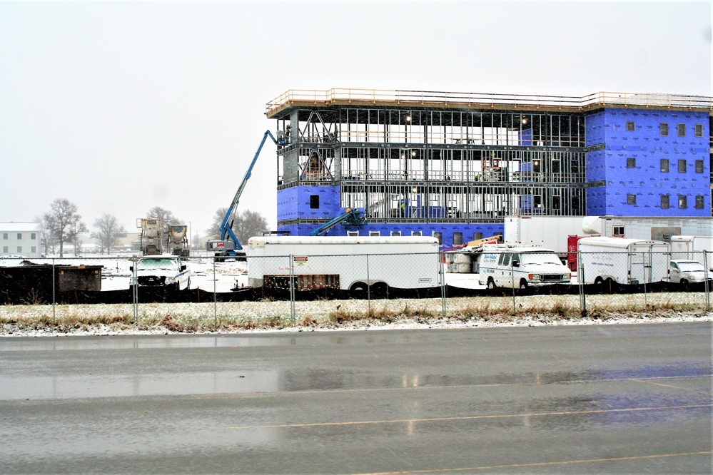 Barracks construction during a November snow at Fort McCoy