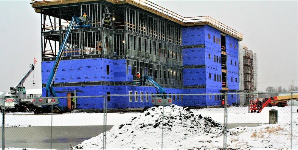 Barracks construction during a November snow at Fort McCoy