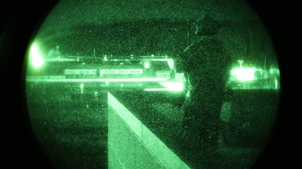 Green Beret scans rooftops