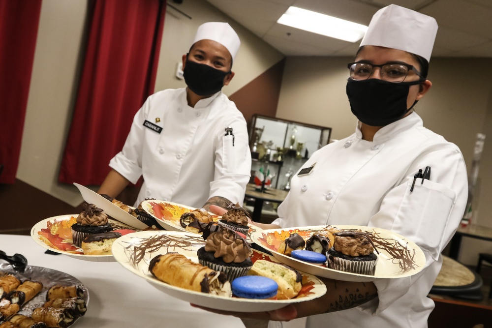 Soldiers from Whitside Dining facility present their spread of European deserts