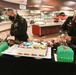MG D.A. Sims and CSM Raymond S. Harris cut the 1st Infantry Division cakes during the Thanksgiving meal
