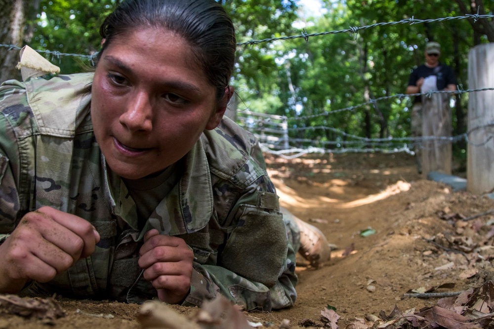 Staff Sgt. Samantha Garcia low crawls for spurs