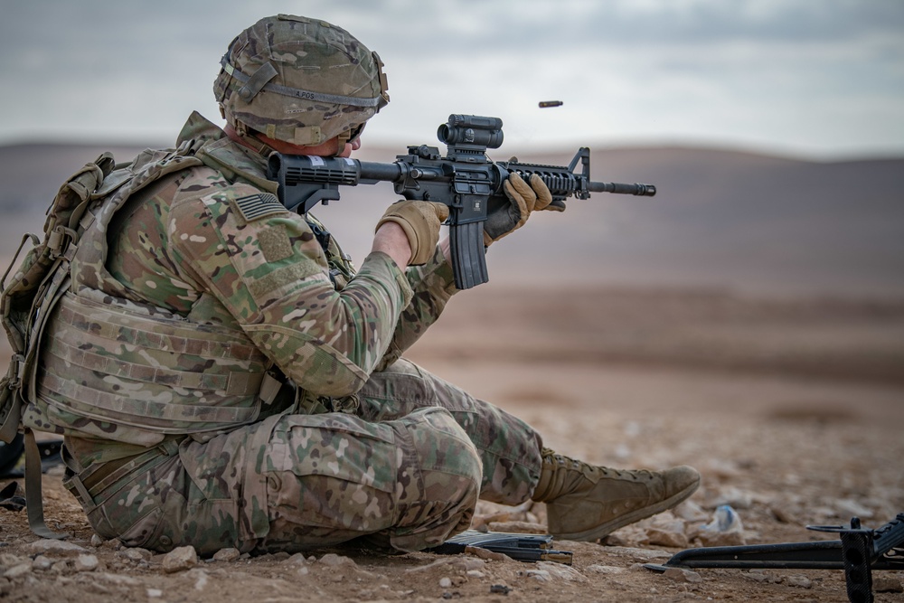 Soldier fires an M4 rifle