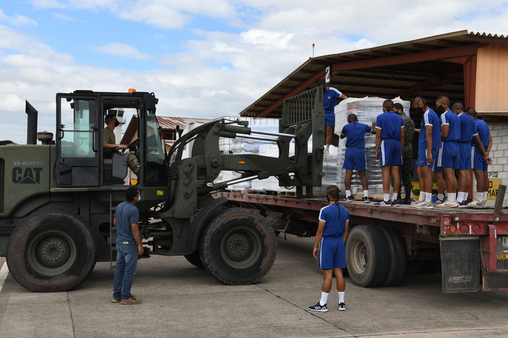612th ABS and Members of the Honduran Air Force Unload Pallets of Humanitarian Assistance