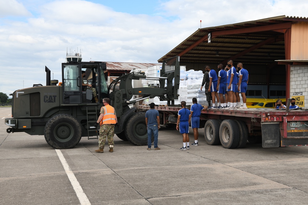 612th ABS and Members of the Honduran Air Force Unload Pallets of Humanitarian Assistance