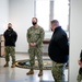 Master-at-Arms 1st Class Damon Harris reenlists in the United States Navy