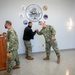 Master-at-Arms 1st Class Damon Harris reenlists in the United States Navy