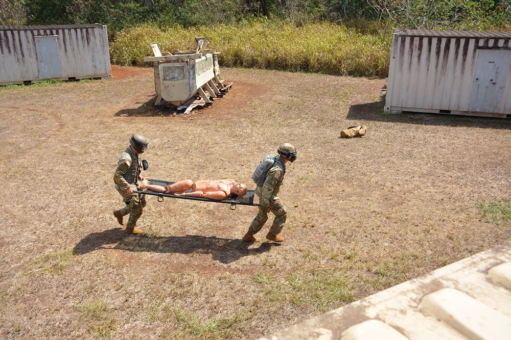 Exercise participants demonstrate use of a litter