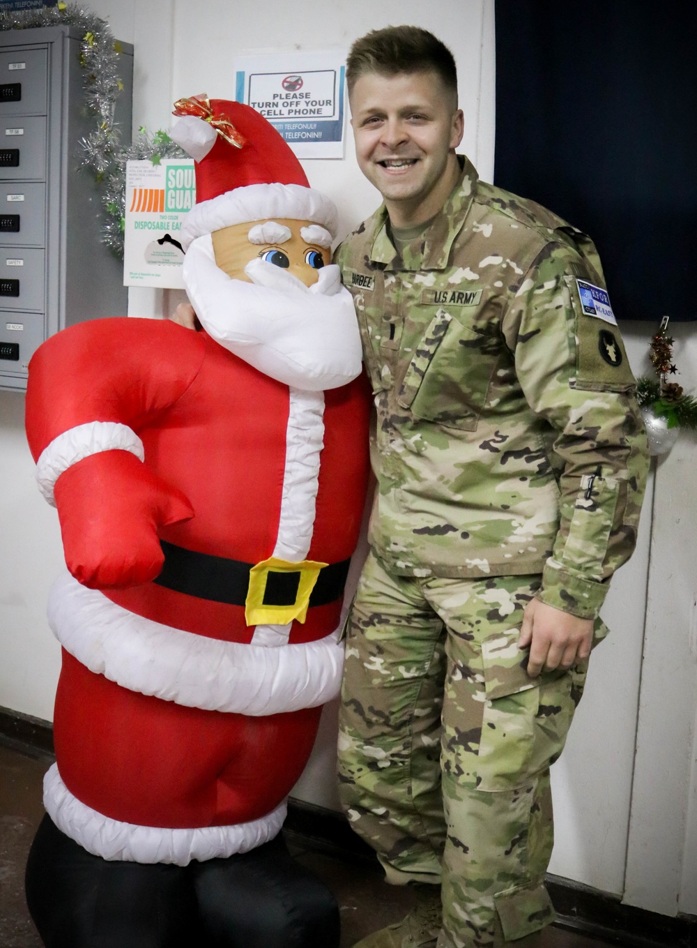 Soldier enjoys holiday deocrations at Camp Bondsteel