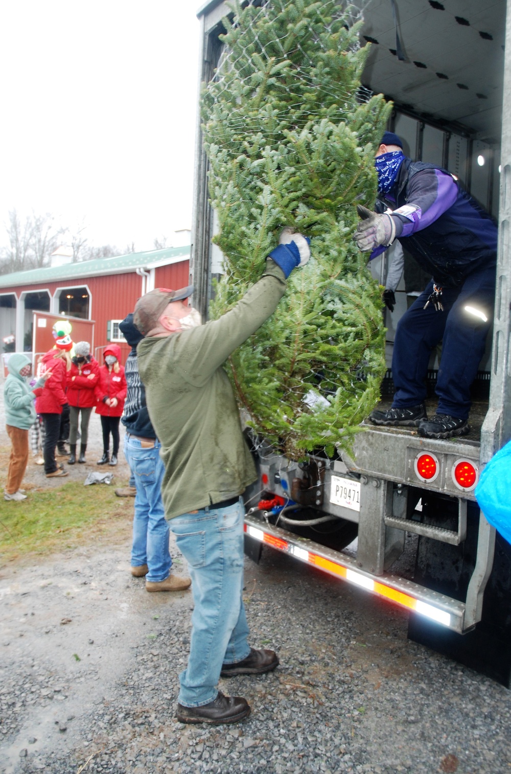 National Guard volunteers join veterans, volunteers for 2020 Trees for Troops loadout