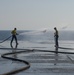 Sailors Conduct Freshwater Washdown