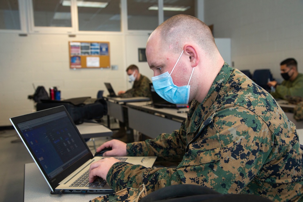 Marines work on computers