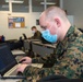 Marines work on computers