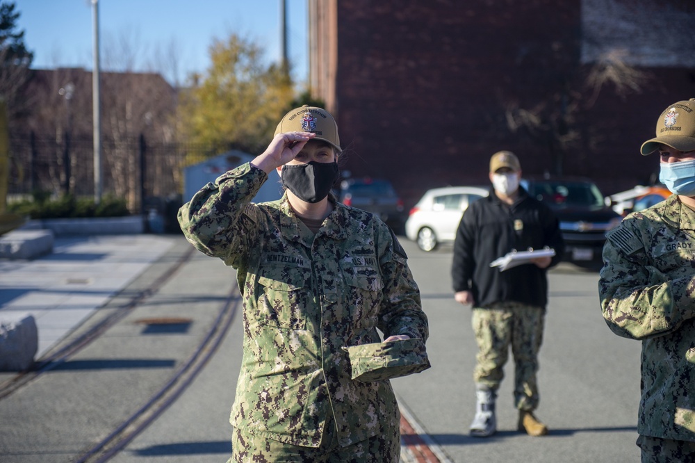 Electronics Technician 2nd Class Michelle Heinztelman recieves ball cap for getting her Basic Historian qualification aboard the USS Constitution.